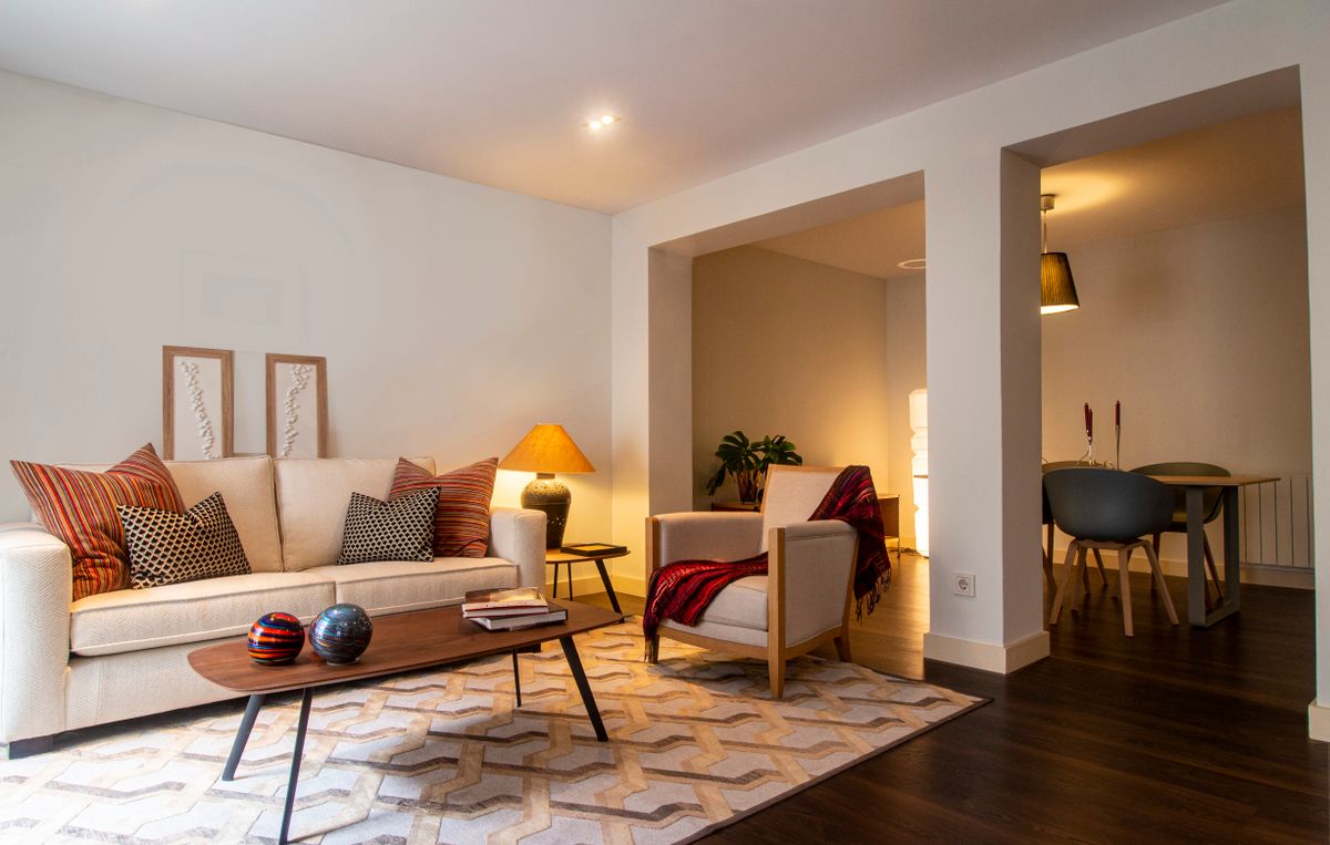 A calm, softly lit living room in the evening, a gentle setting for someone with dementia during fireworks