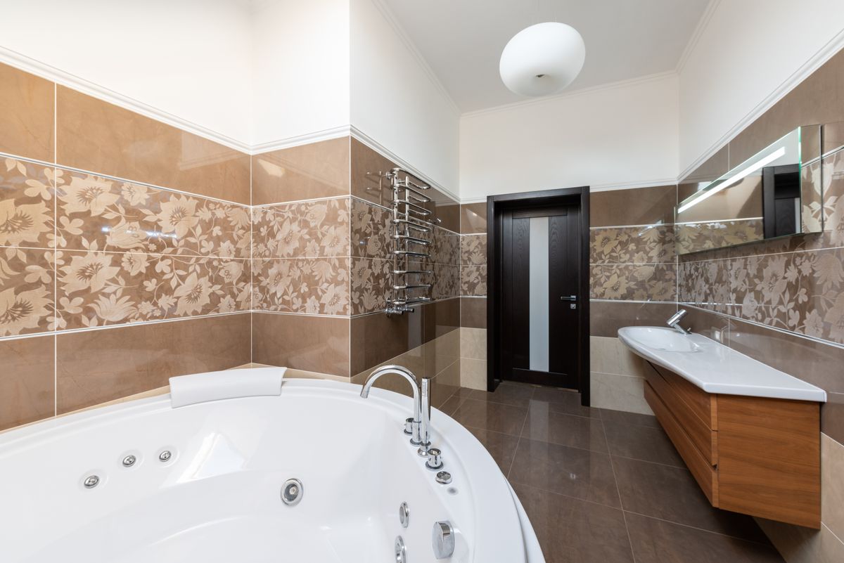 A clean, modern bathroom with a step-in tub