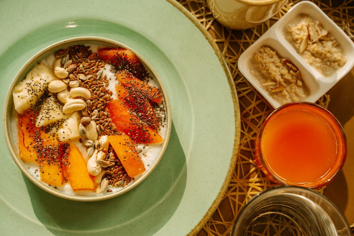 A heart-healthy breakfast bowl with oats, seeds, nuts, and fruit
