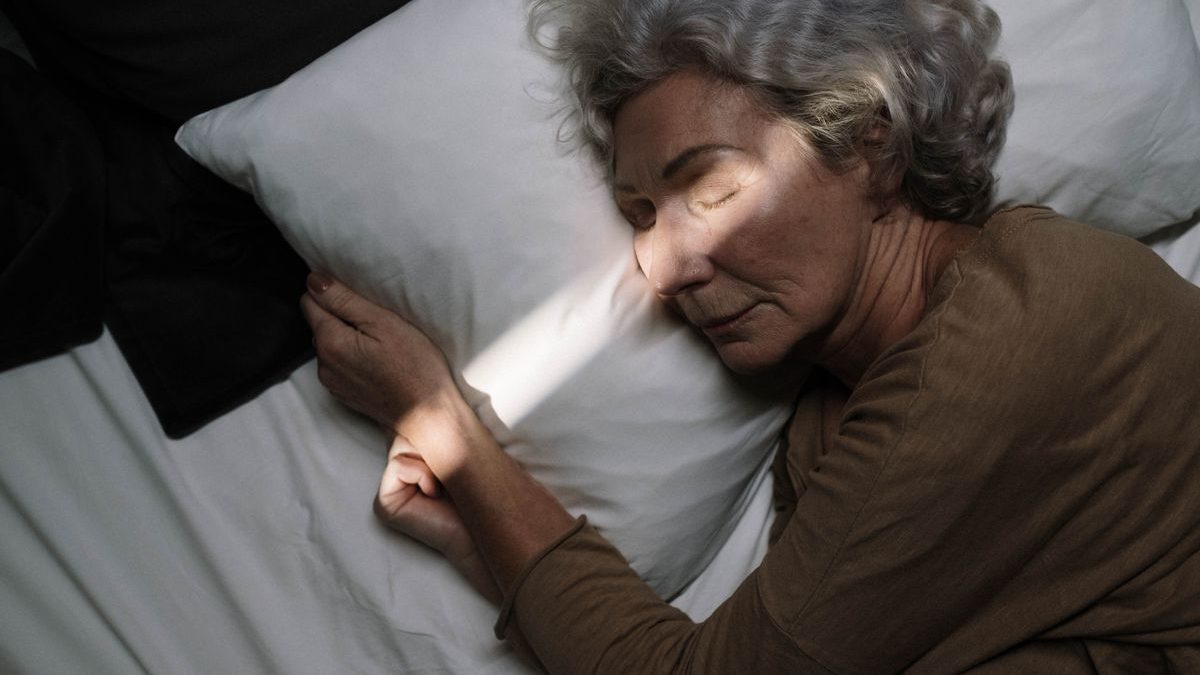 An older woman sleeping peacefully at night